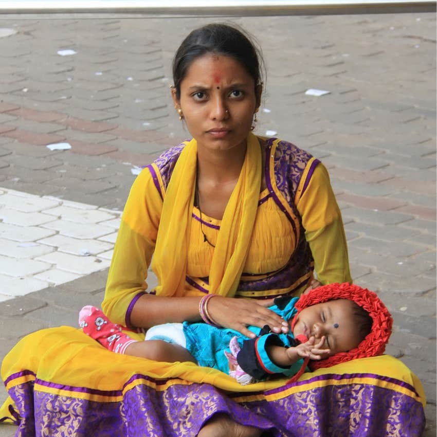 mother holding a bay who was born unwanted