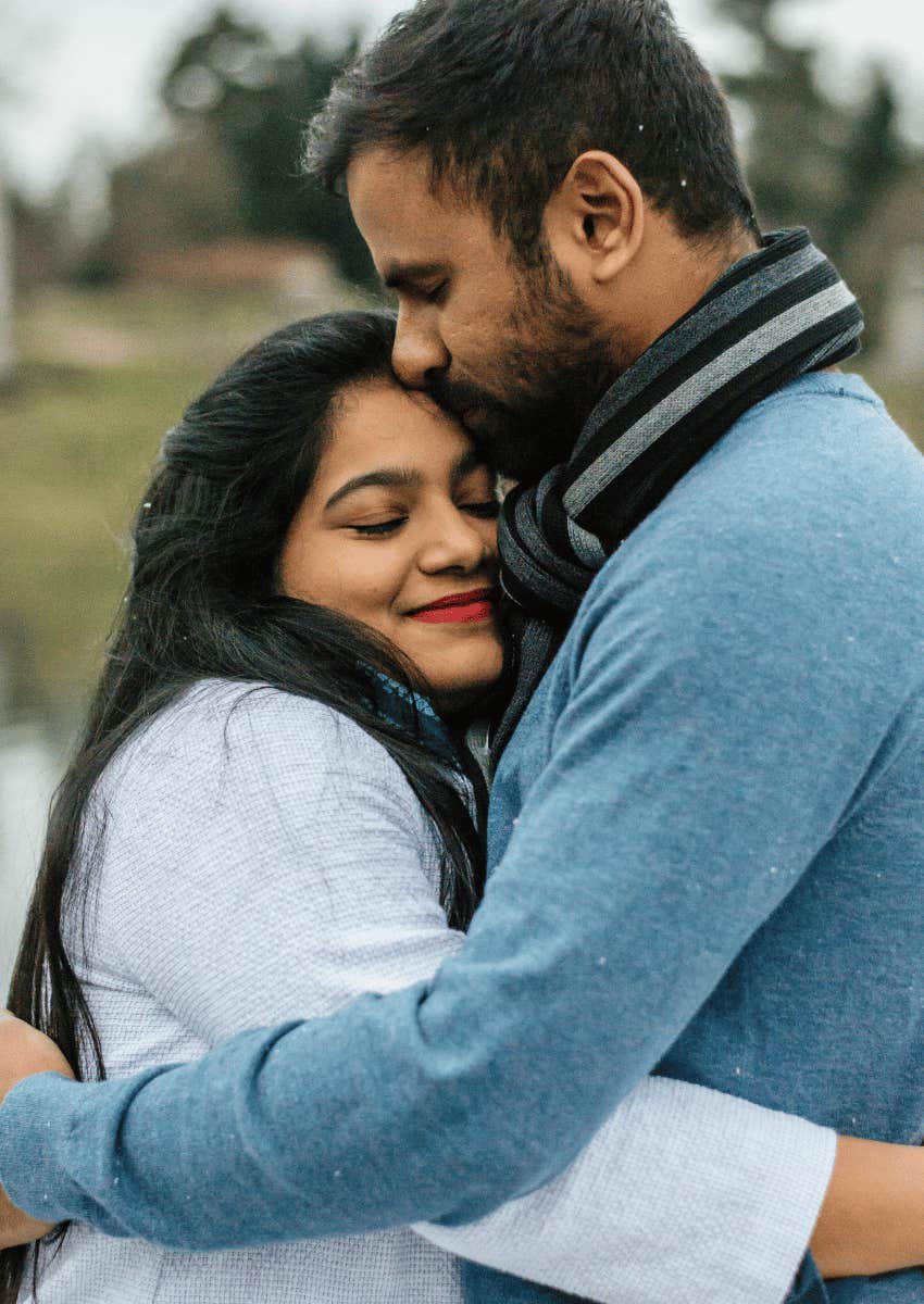 couple hugging each other close