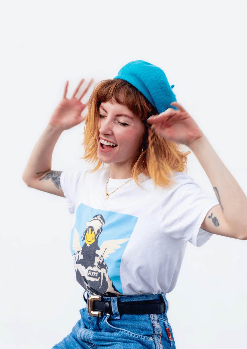 energetic young woman wearing a blue berrett