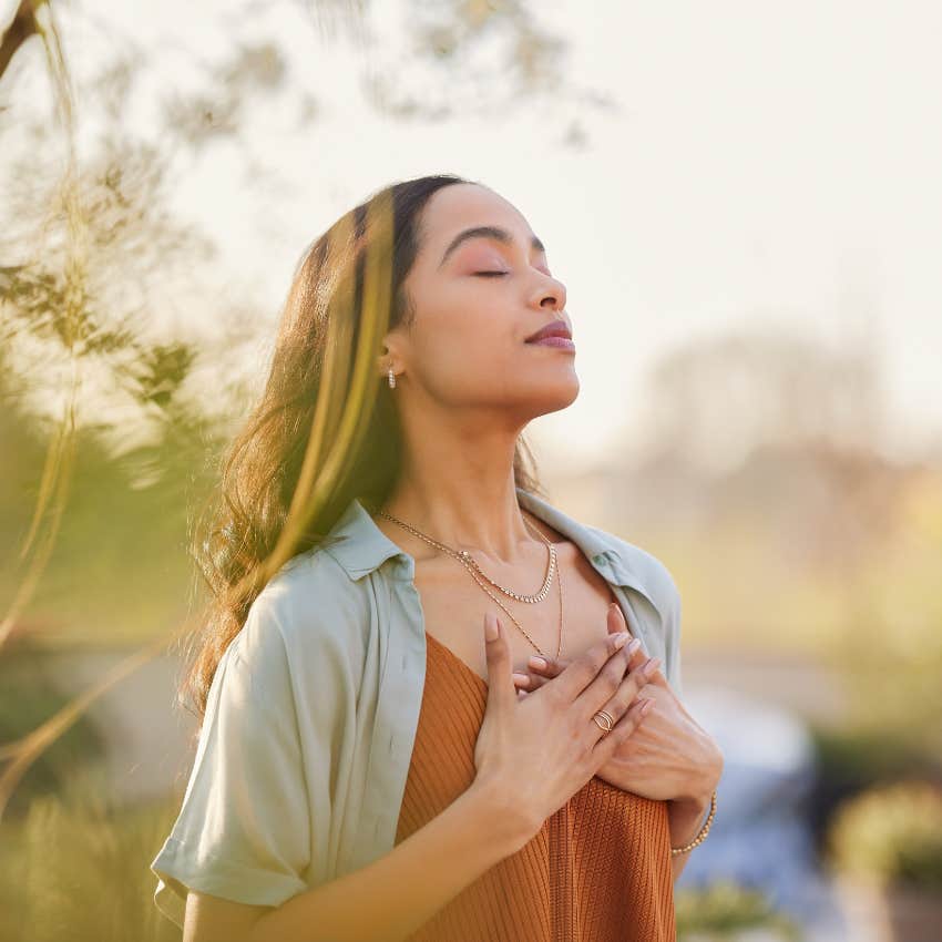 woman who does the everyday habit of breathing to relax