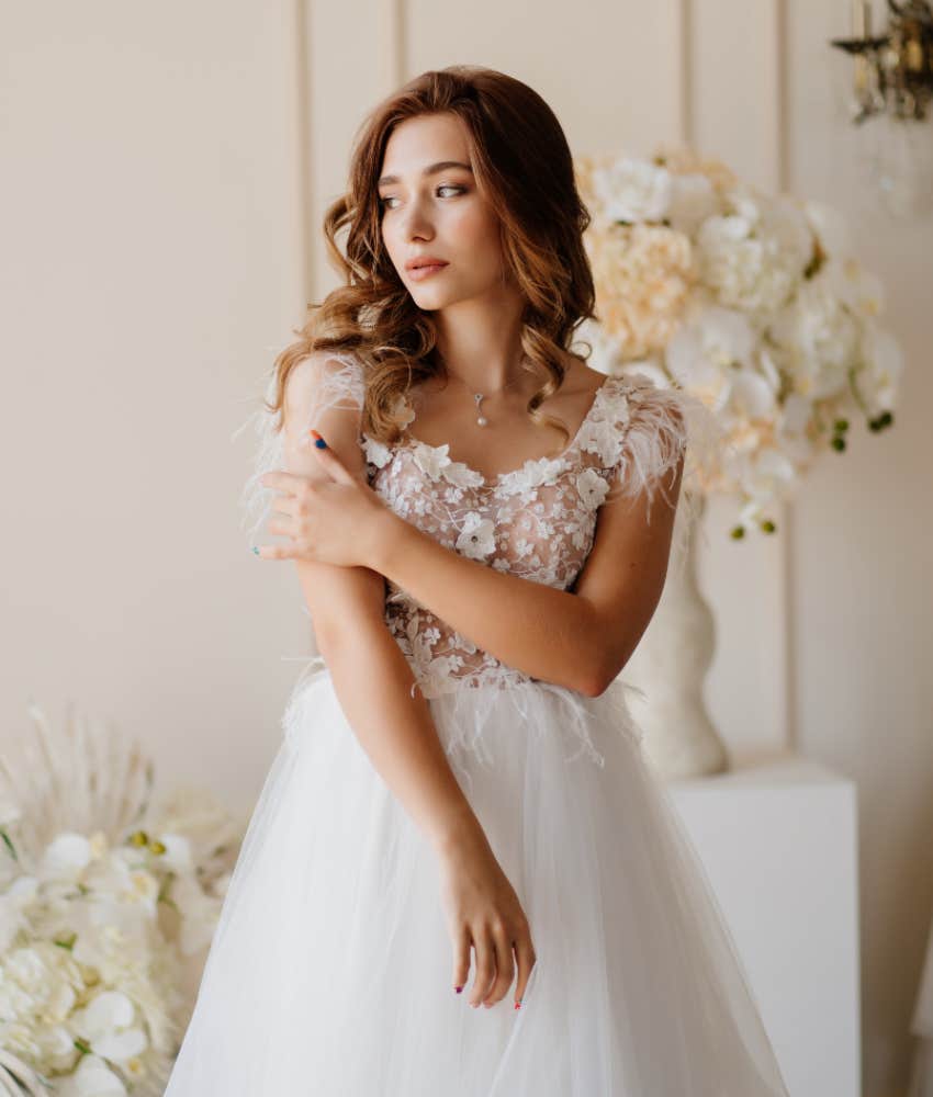 young, sad bride in wedding dress