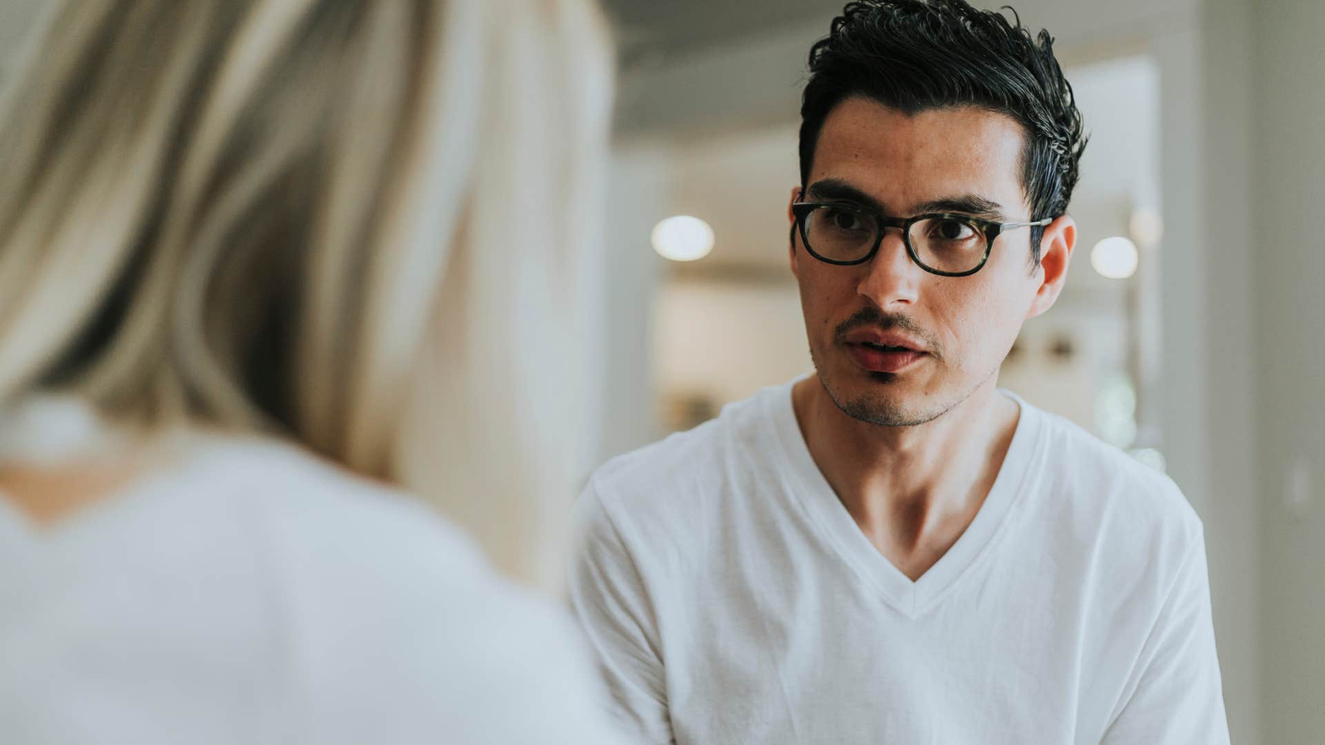 defensive man saying why do you blame me for everything to confused partner