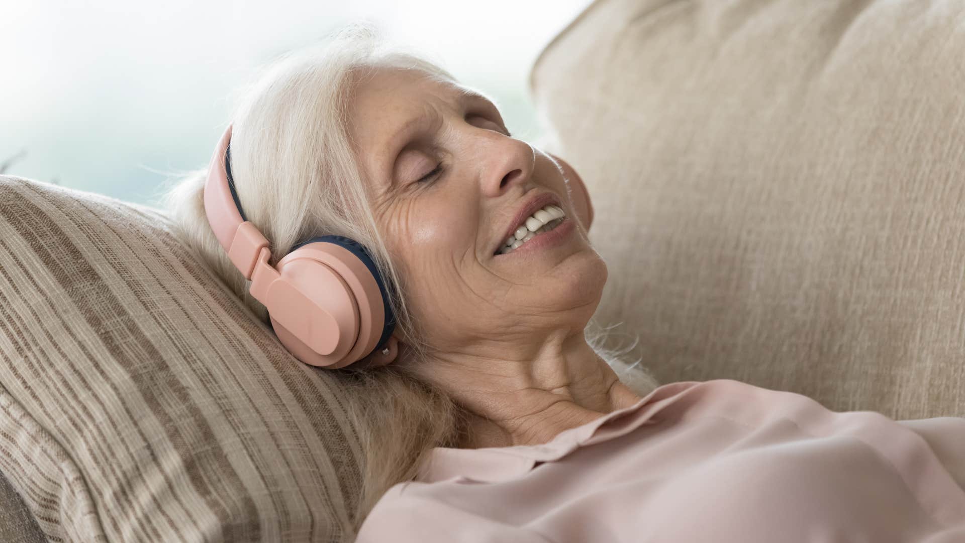 older woman listening to music at home