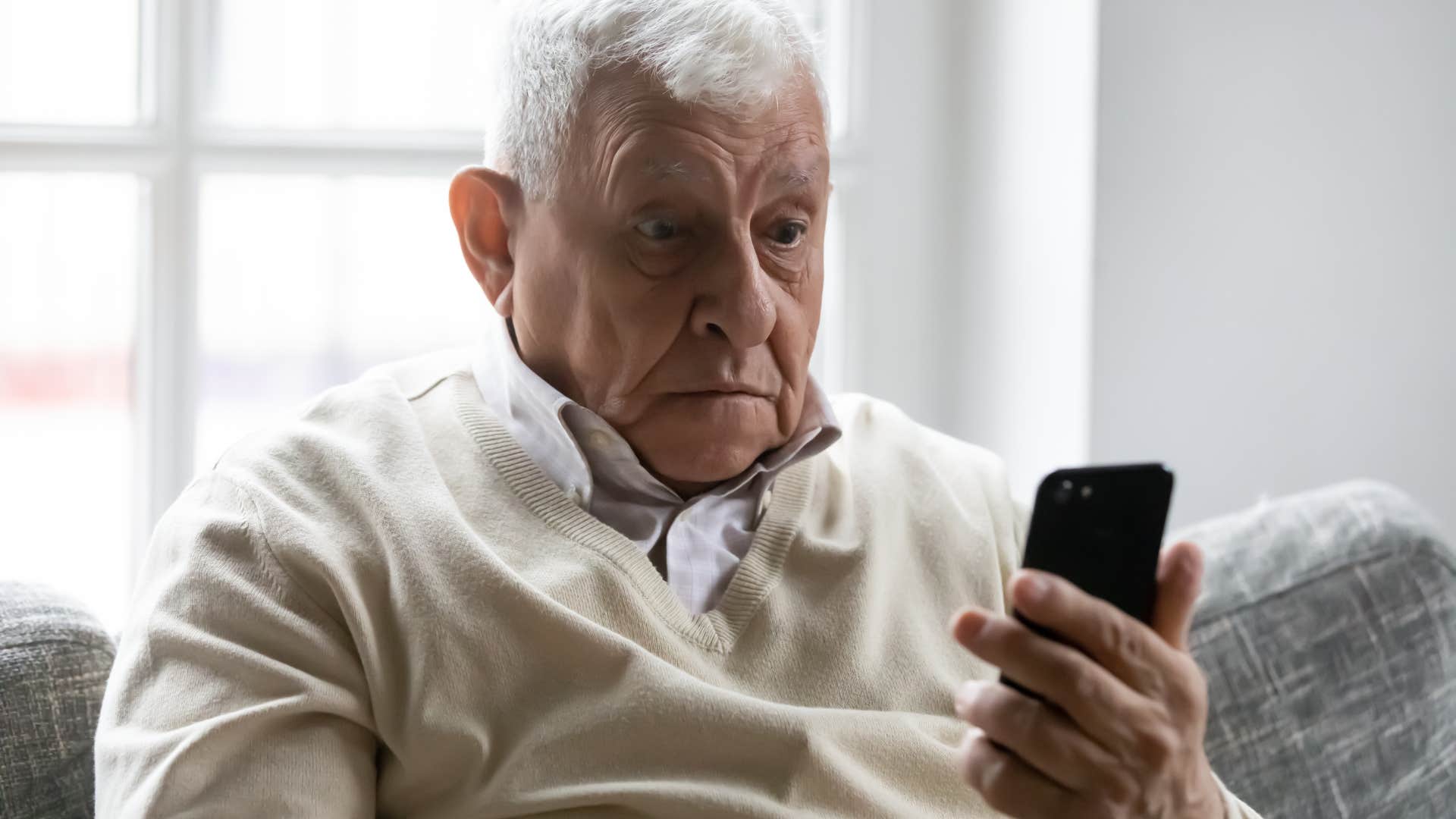 older man confused about the newest technology