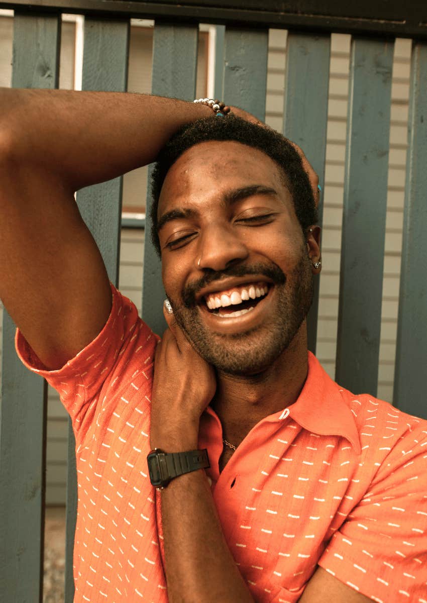 man smiling big with happiness