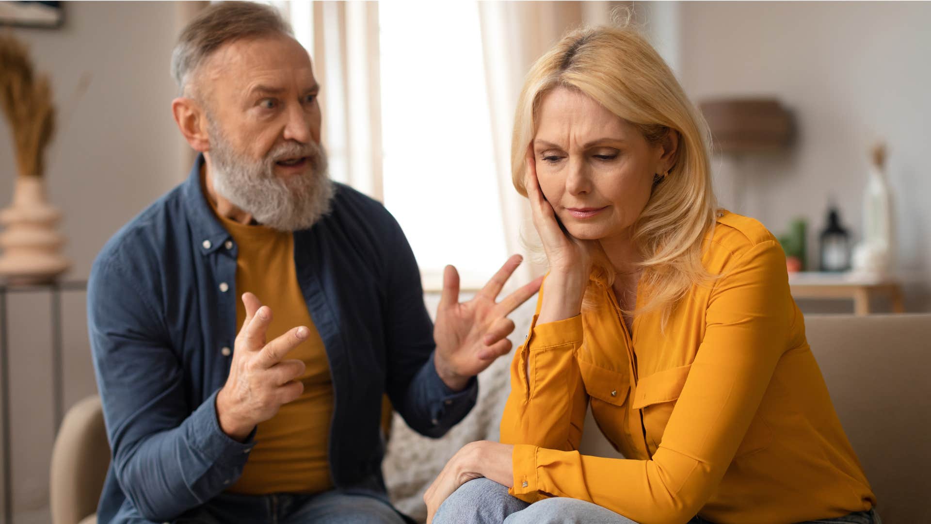 man comparing his upset partner with others