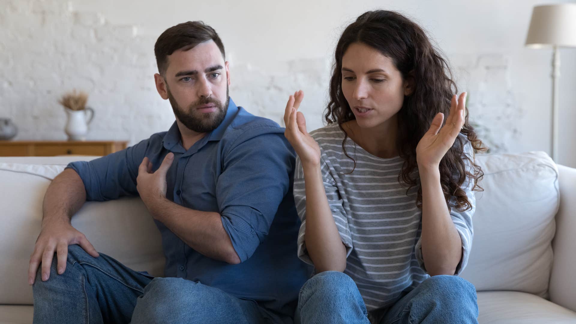 man arguing with partner making her upset