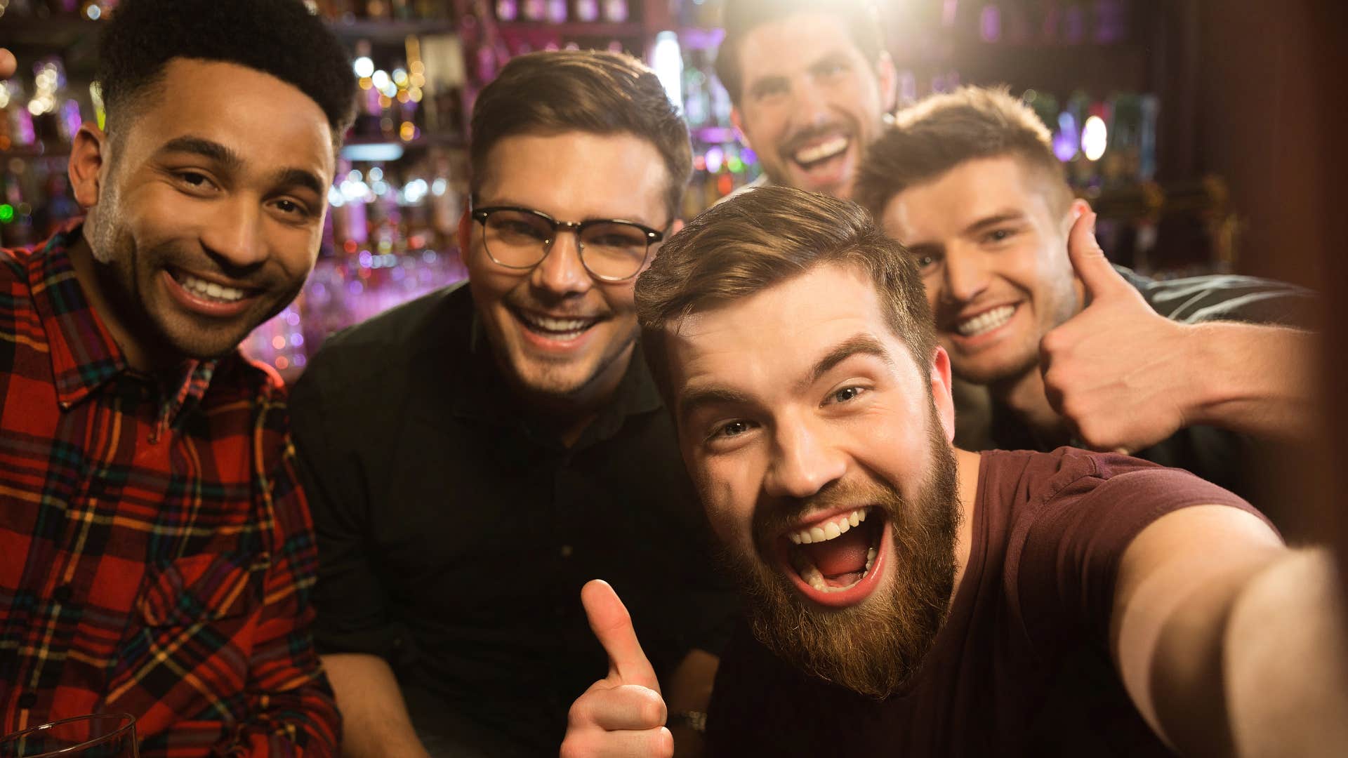 man spending time with friends who normalize cheating