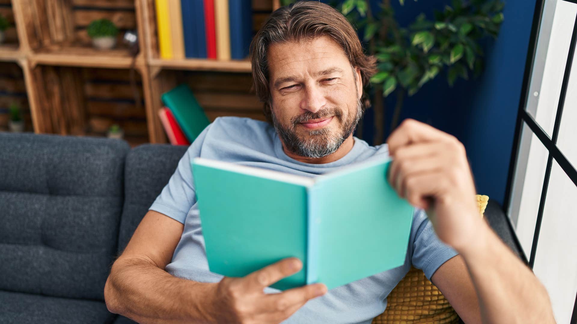 intelligent man reading a book