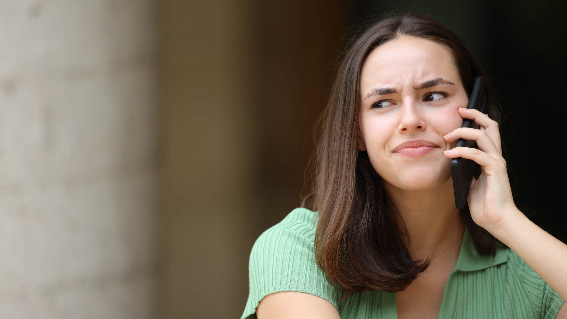 woman in green shirt engaging in pointless small talk with no direction