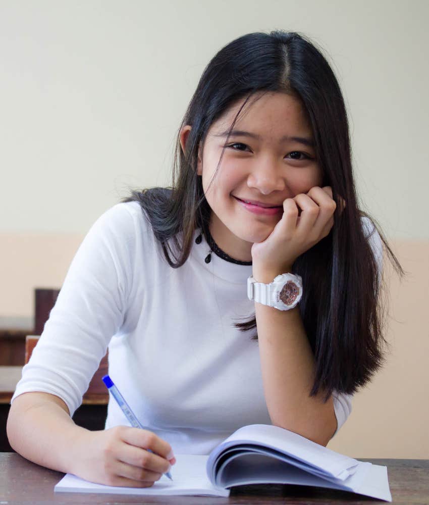 Person writes in gratitude journal