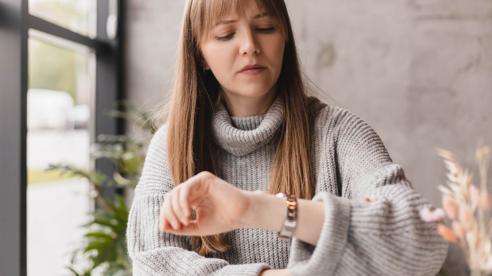 woman wondering how many hours she would have to work to pay for something