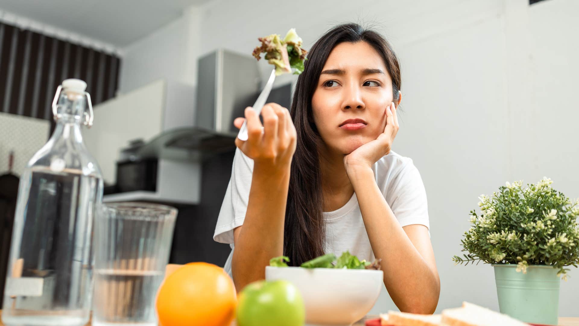 woman trying a fad diet eating a salad