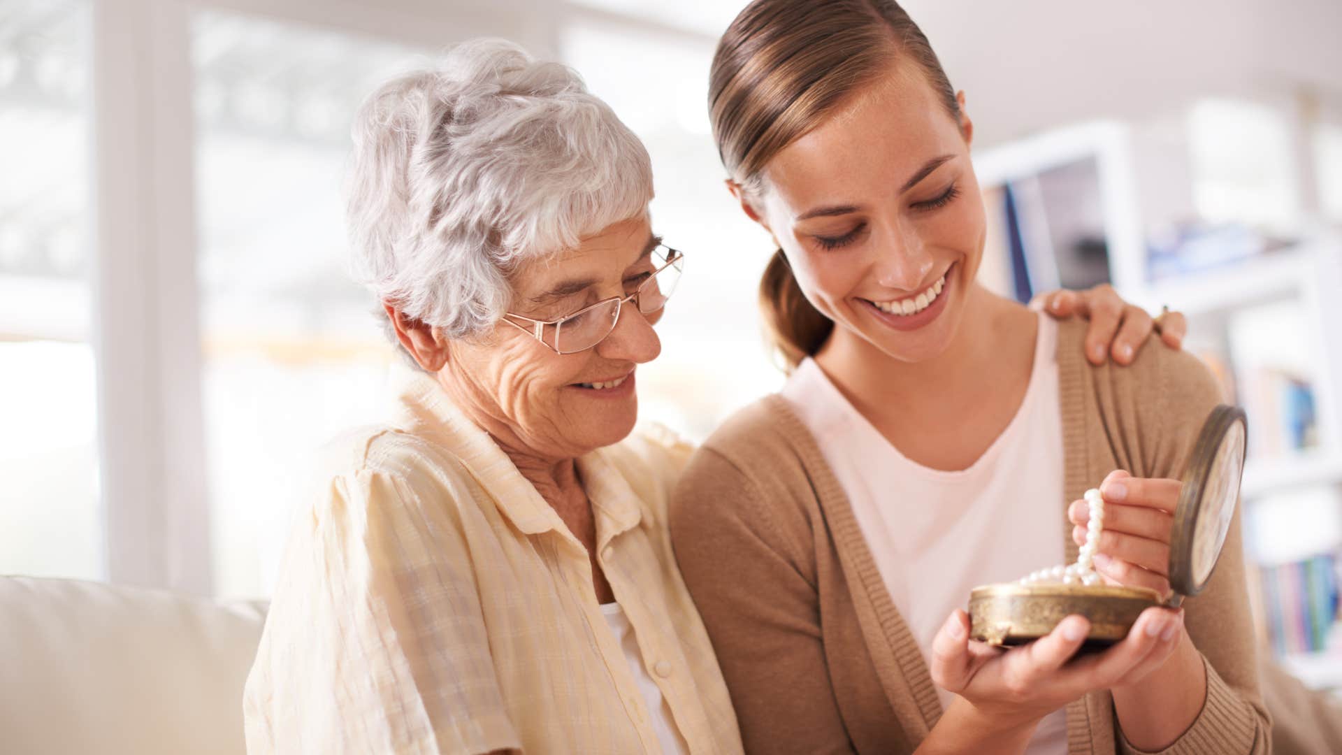 mother and daughter looking at jewelry that has been in the family for years