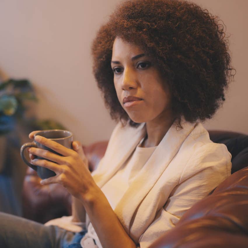 Woman pausing before responding while talking to a friend