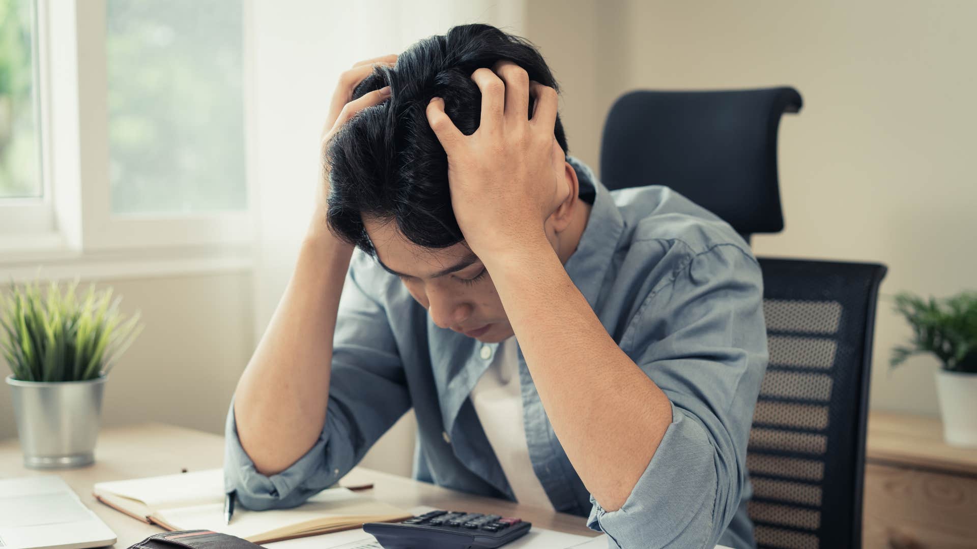 man looking at expensive mortgage