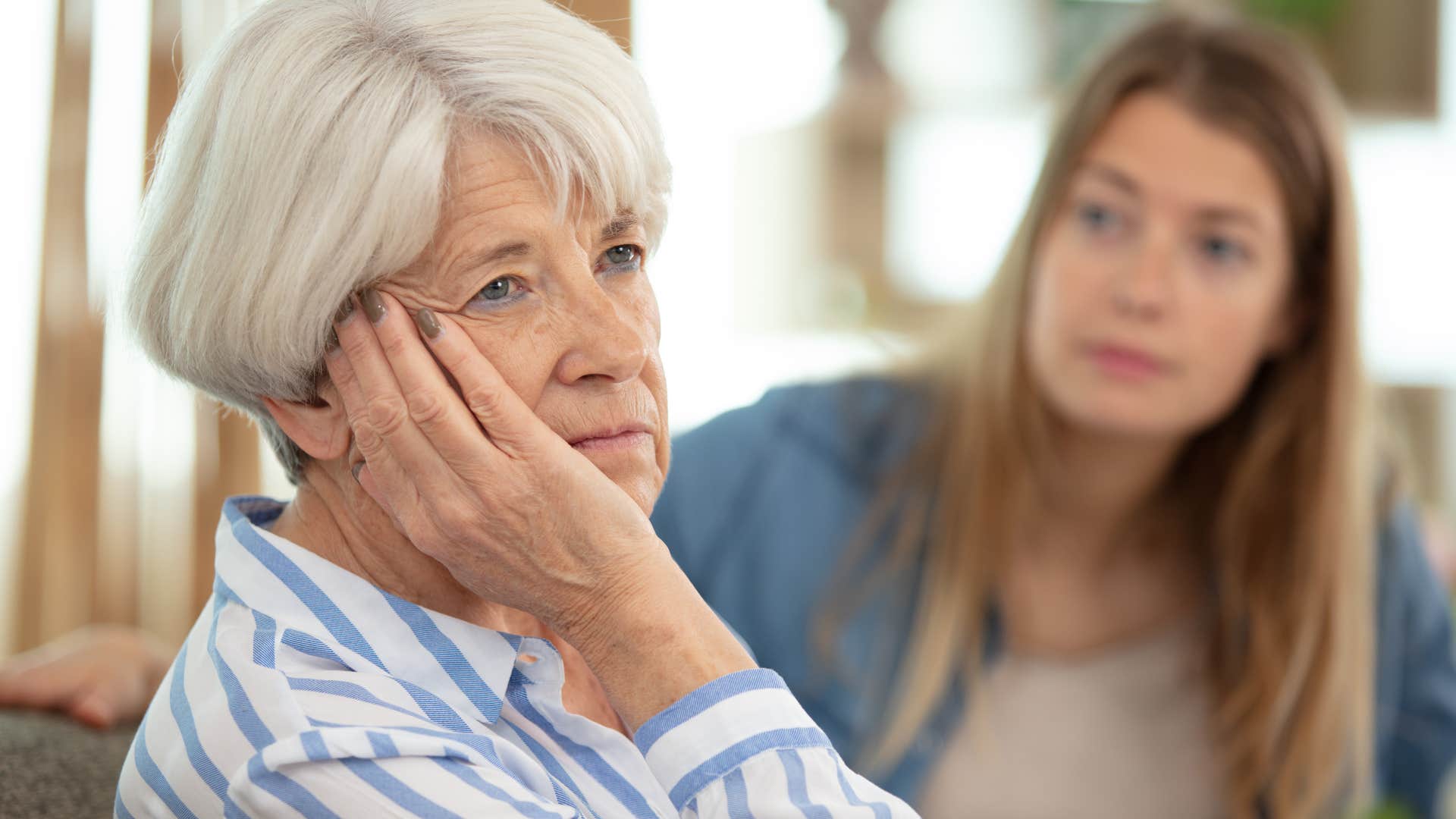 older woman who feels misunderstood turned away from her daughter