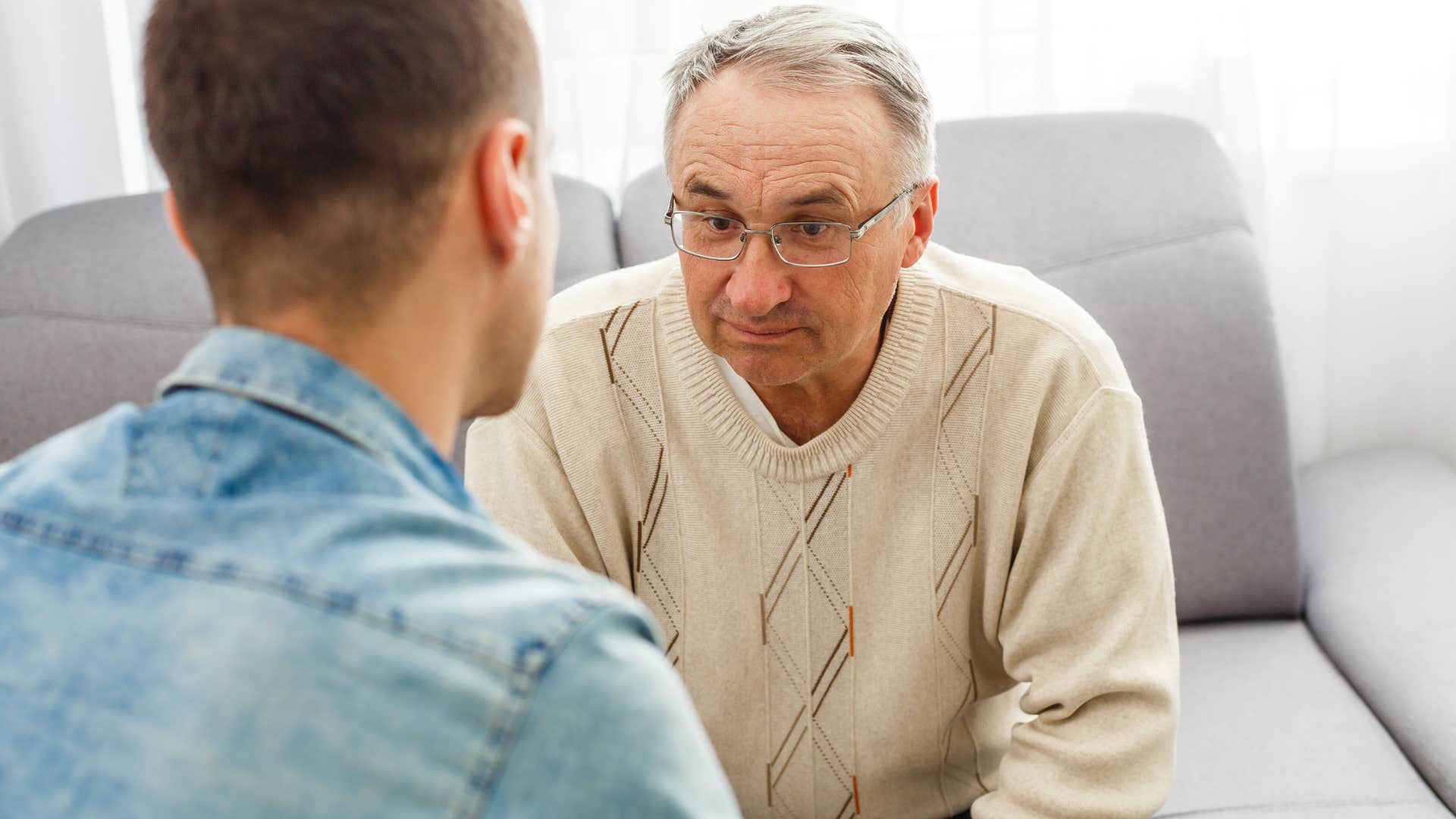 man who craves meaningful connections talking to his son