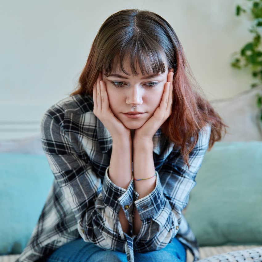 woman who is feeling fatigued as someone is sending her bad energy