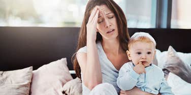 stressed out mom holding baby