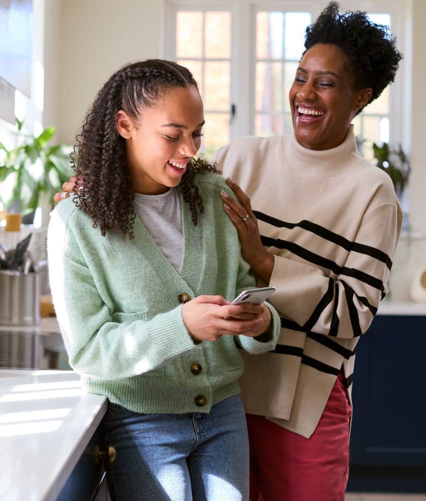 Happy teen and parent share fun moment at home 