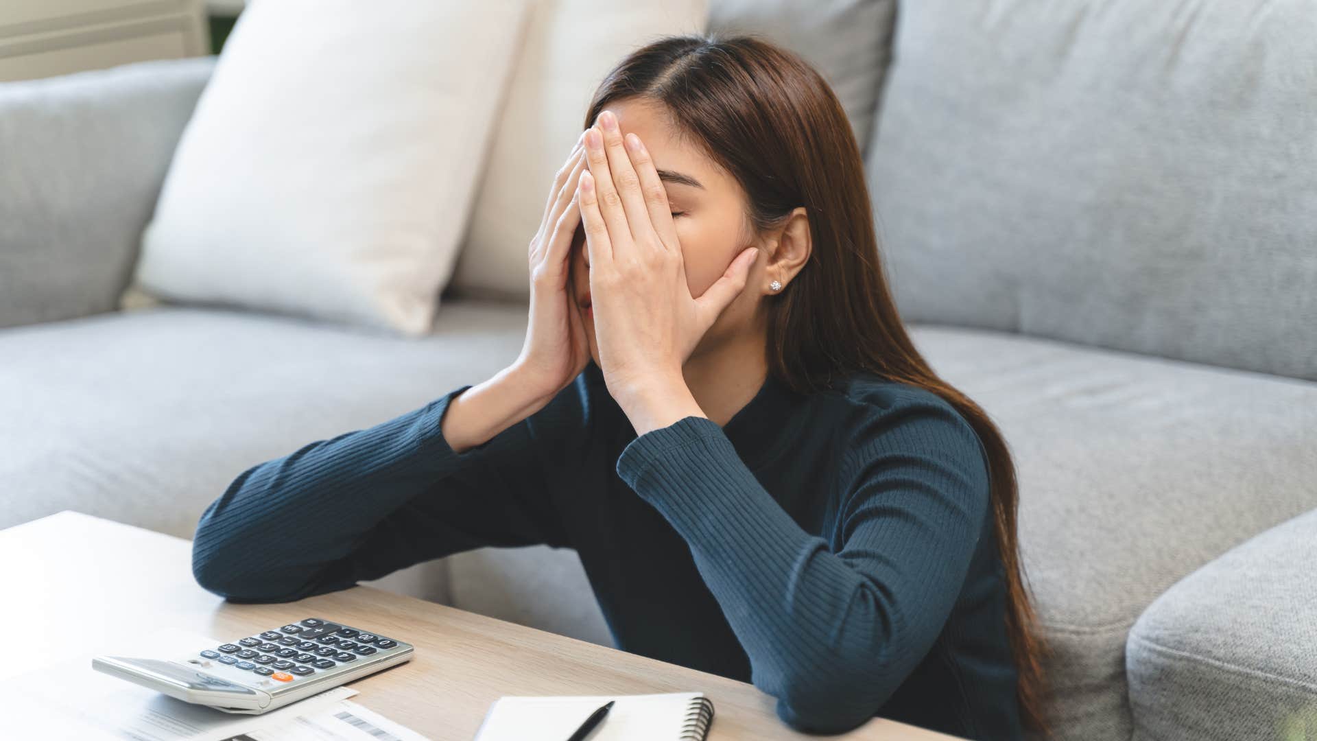 woman who is falling behind financially avoiding talking about credit cards