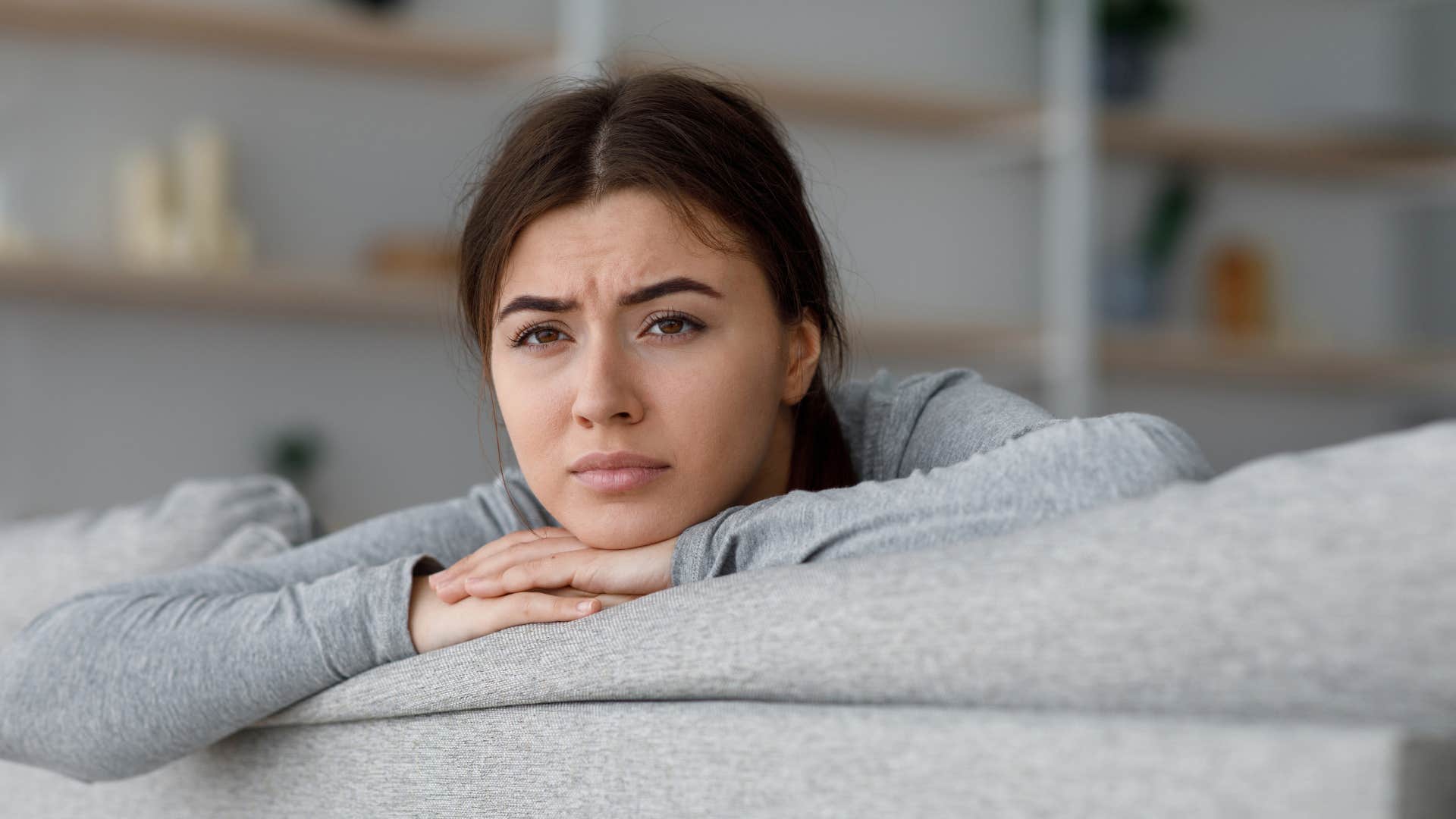 woman with daddy issues alone at home struggling to ask for help