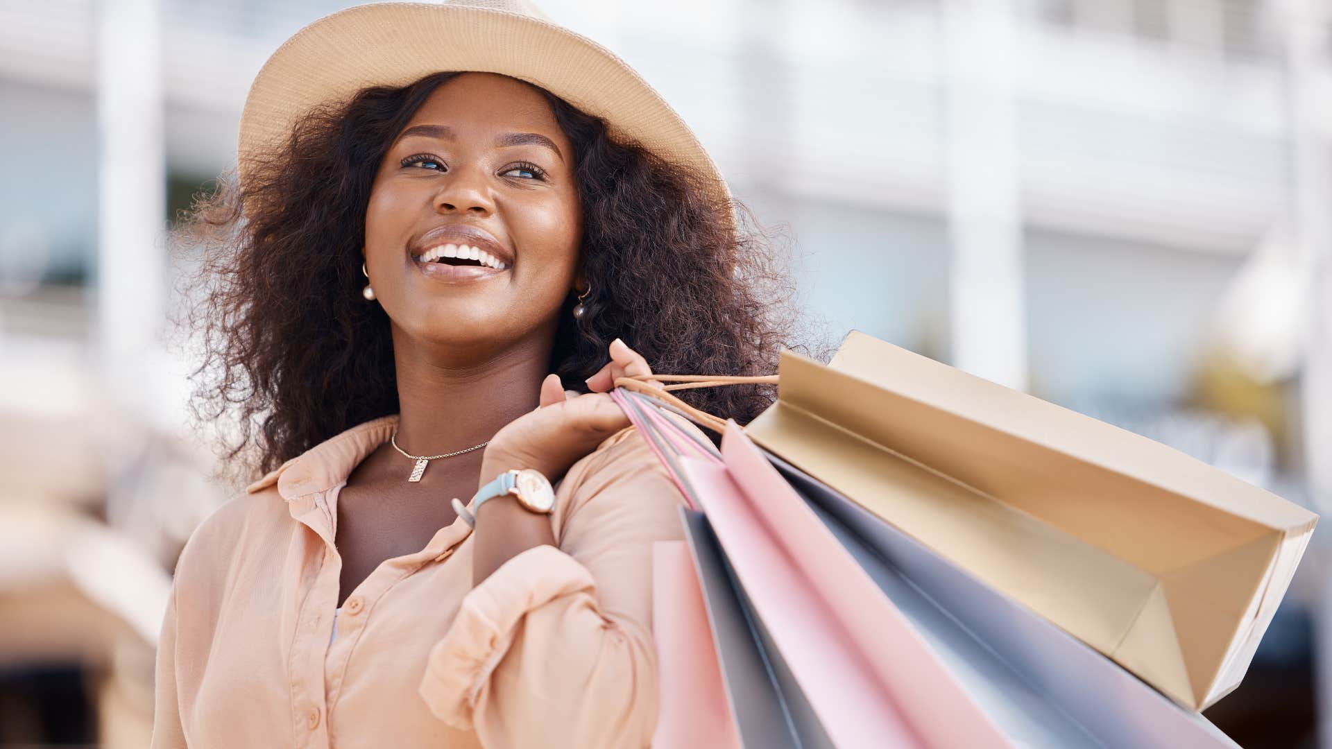 wealthy woman holding lots of shopping bags