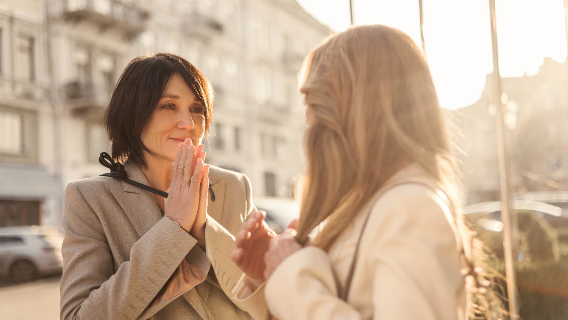 wealthy women in public talking about their experiences