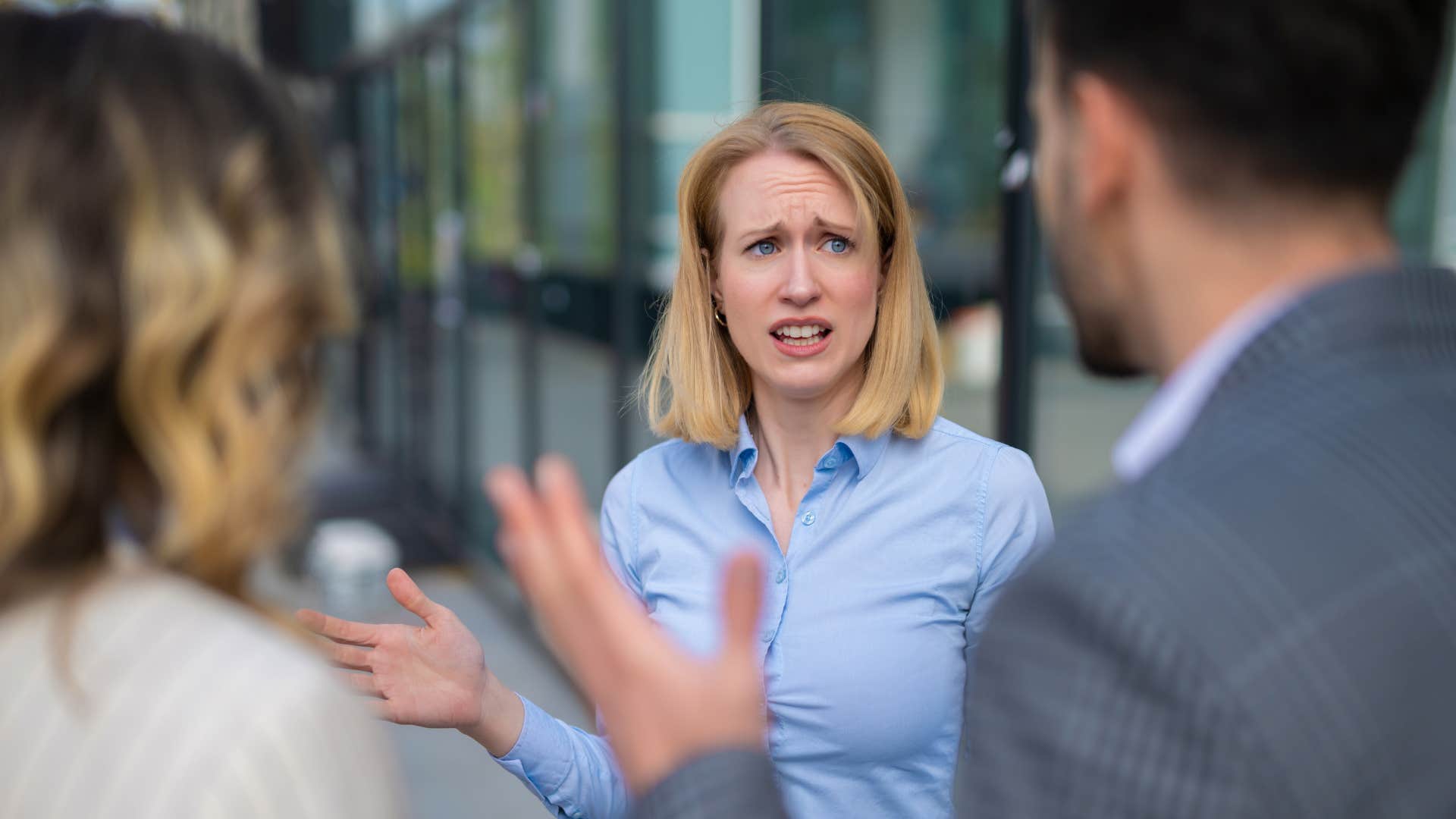 woman feeling on edge at work with co-workers
