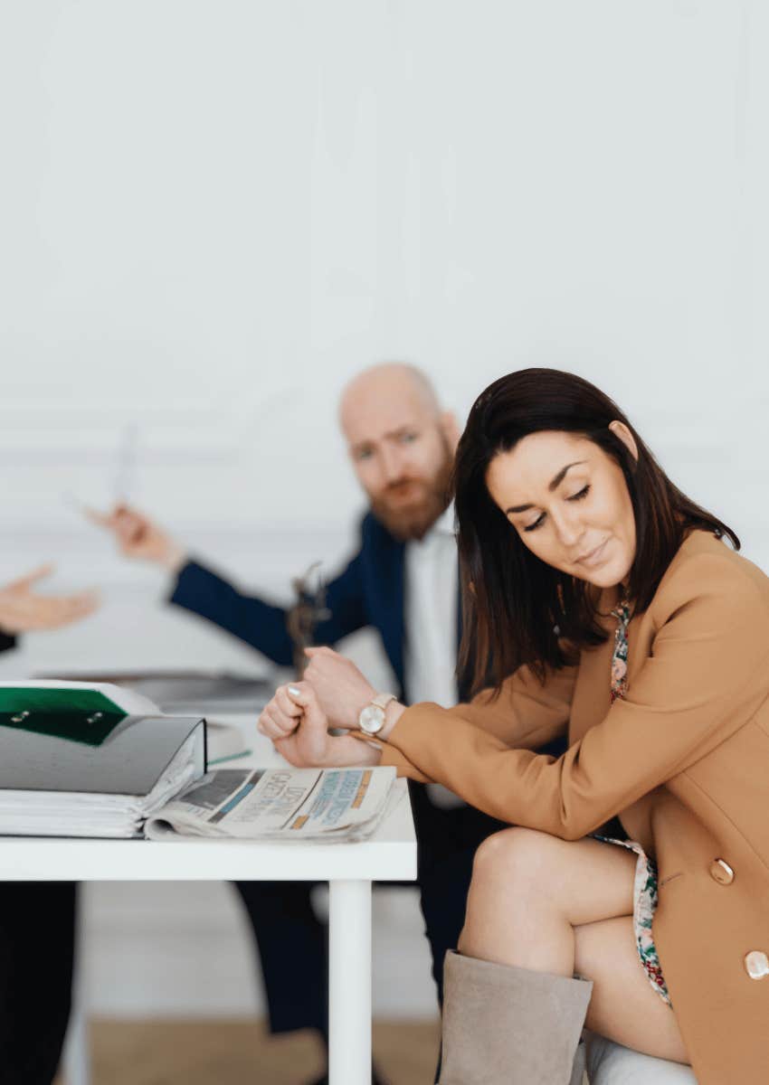 woman looking away from man during divorce negotiations