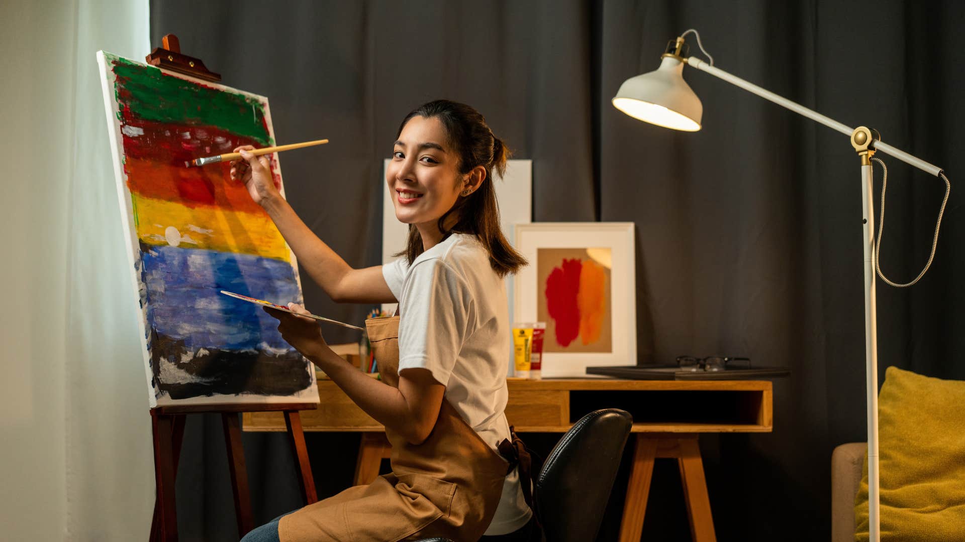 woman painting enjoying new hobby